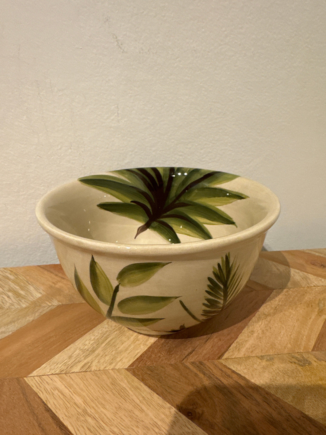 Bowl with green leaves