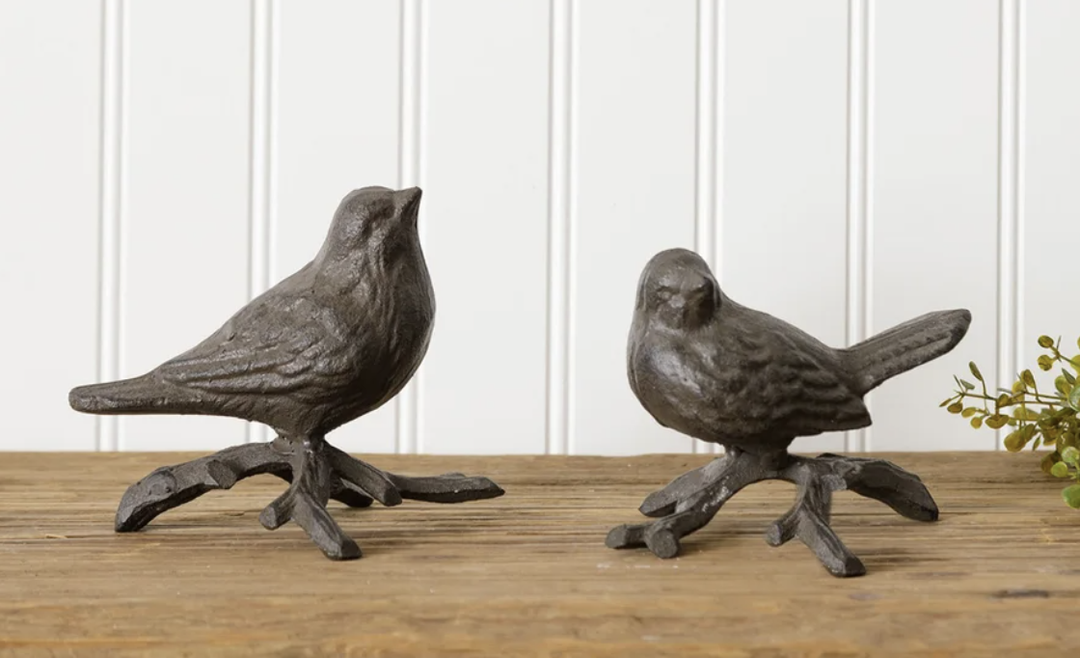 Iron birds on branches